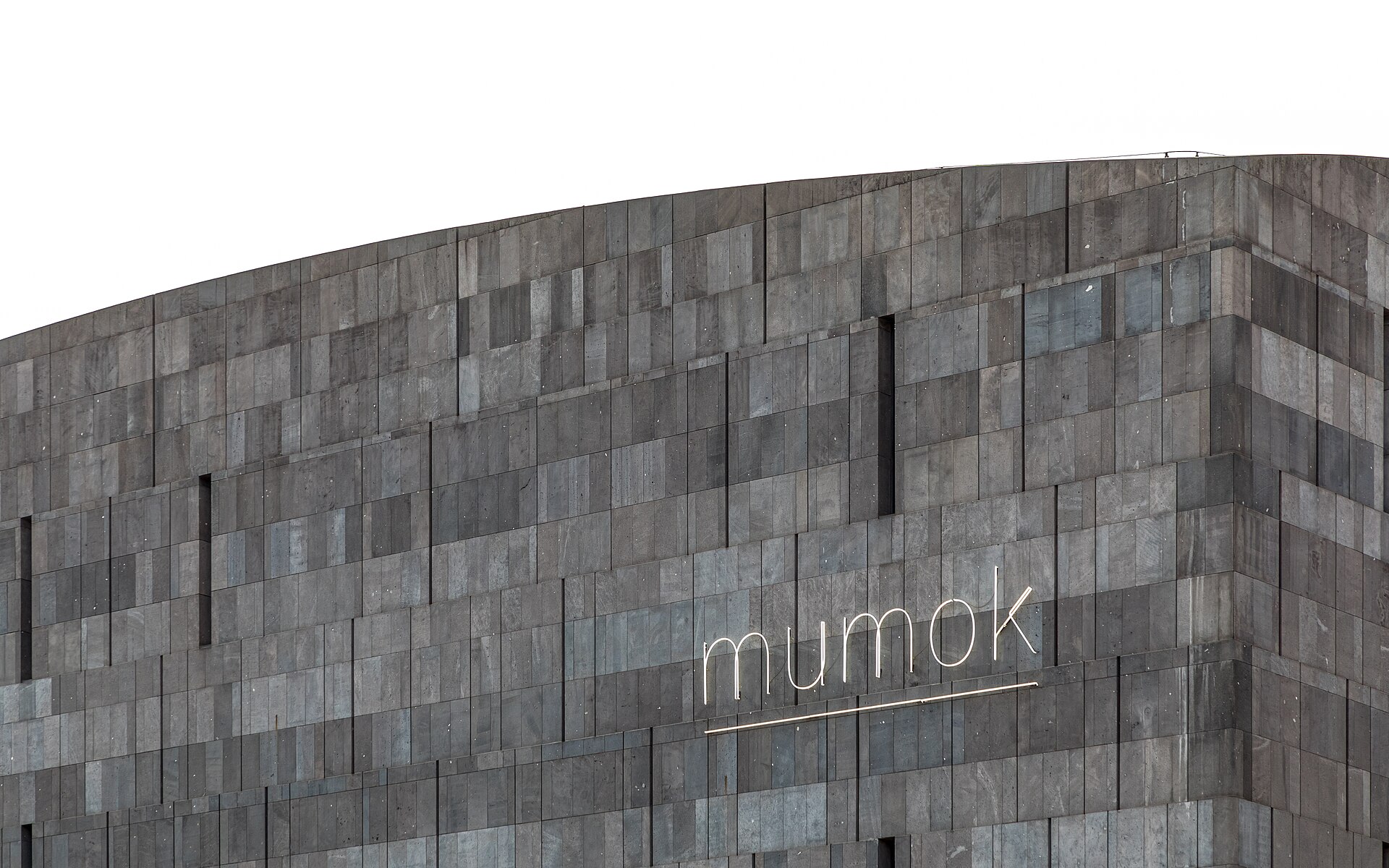The dark stone wall of mumok