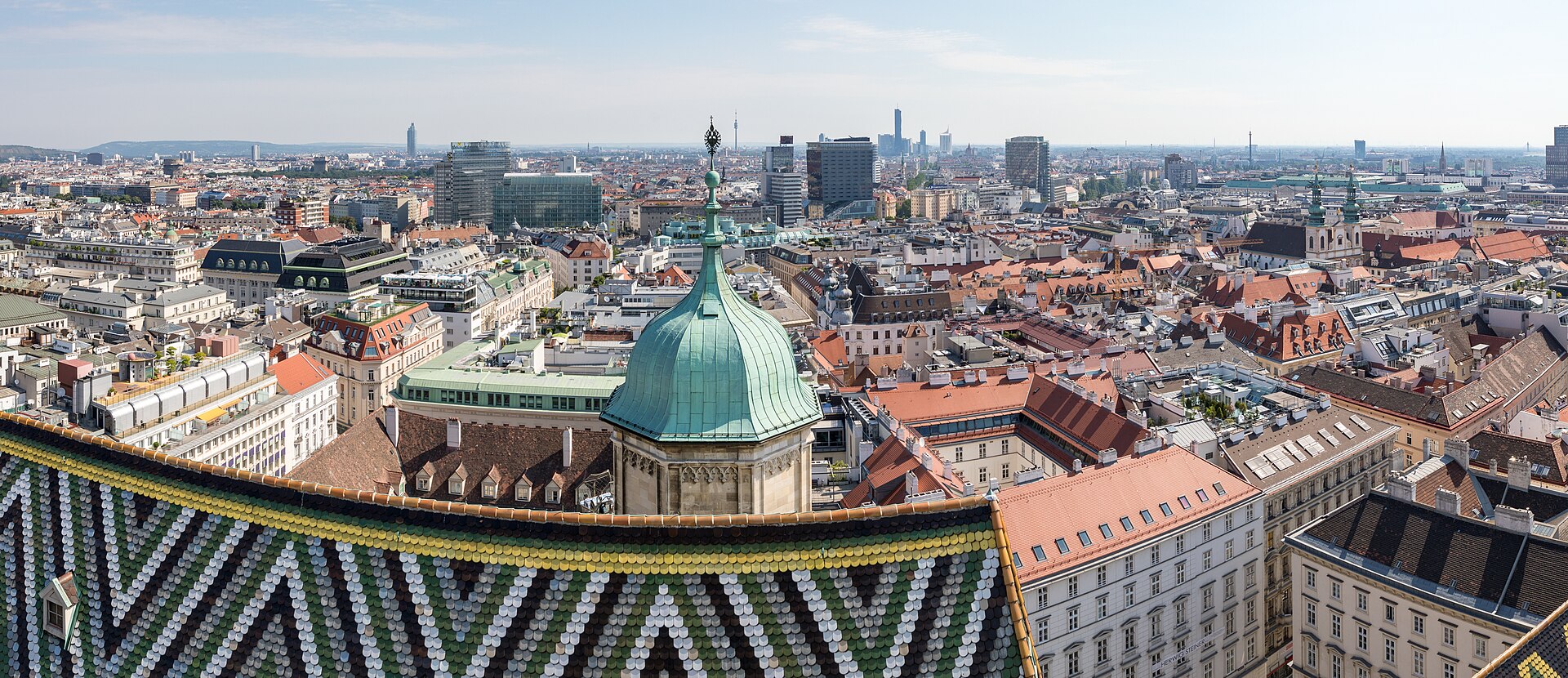The patterned roof of Stephansdom above the city
