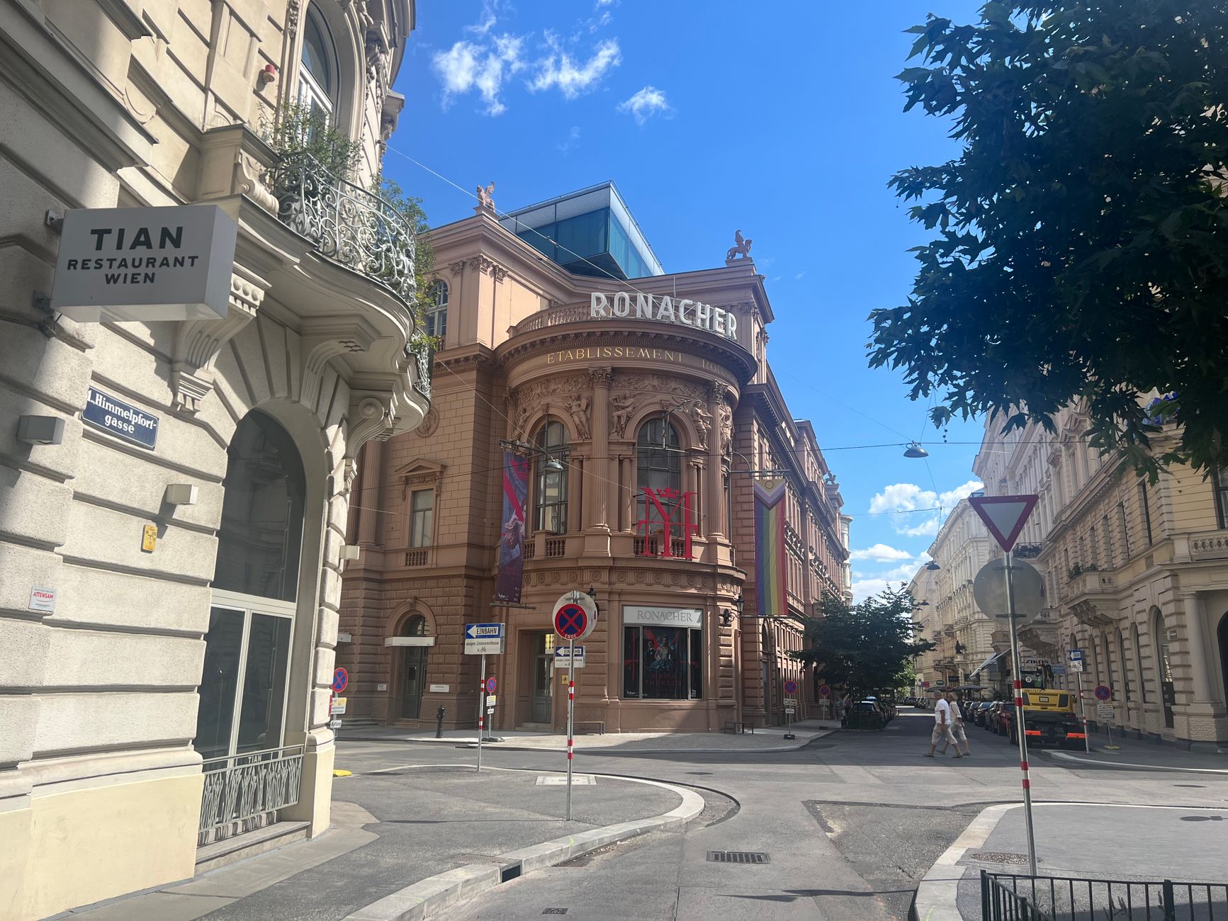 Ronacher Theater and nearby Tian Restaurant in Vienna, Austria, under clear blue skies