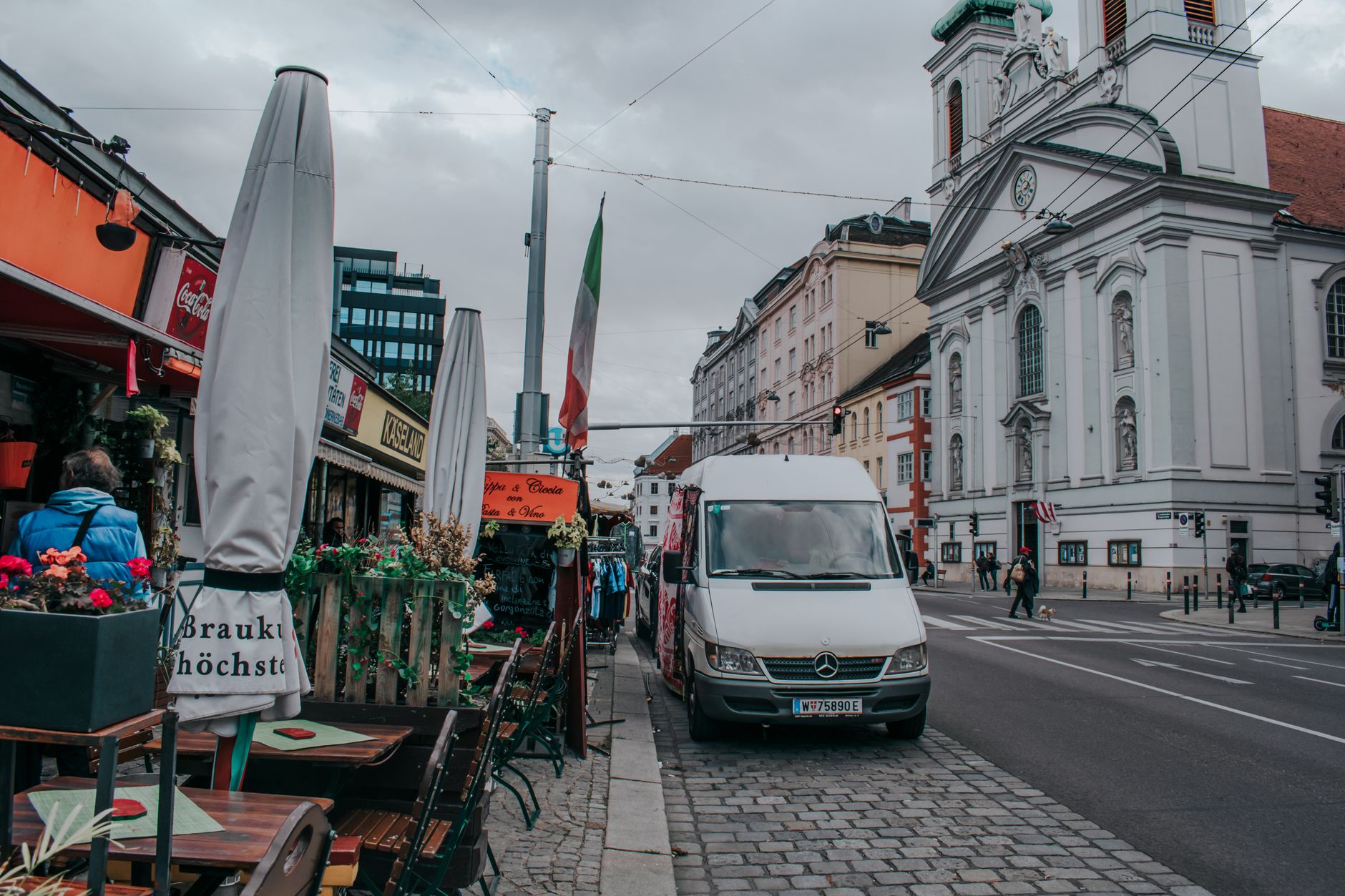 Vienna city street scene featuring historic architecture and sidewalk cafes