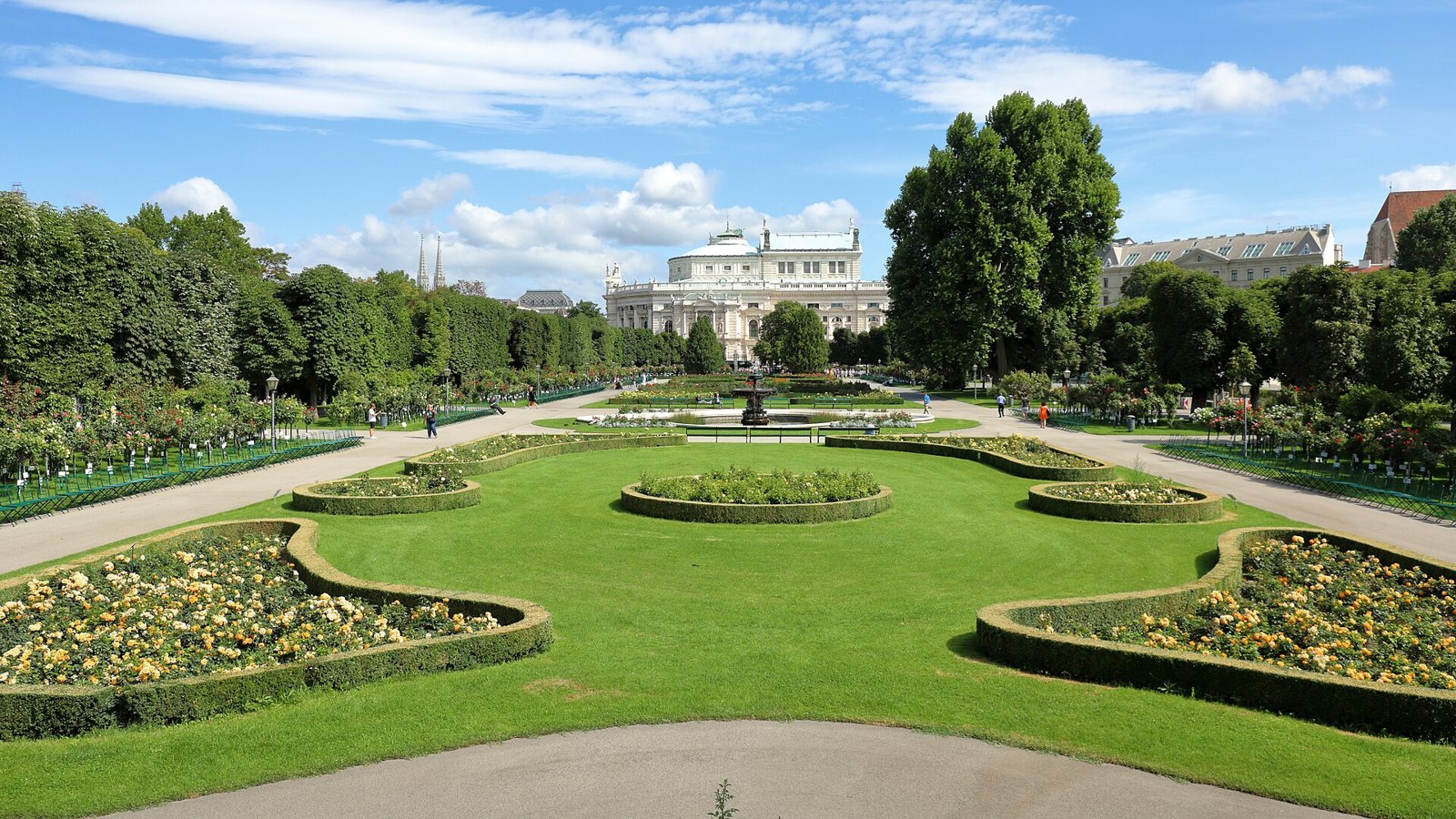 The rose beds of the Volksgarten in Vienna, with the Burgtheater behind